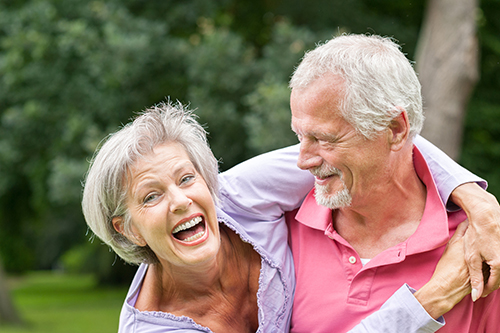 Couple laughing and smiling and having fun outside